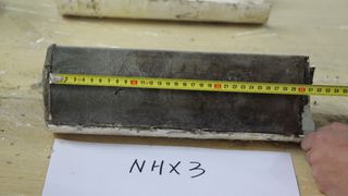 The main sediment used in the study rests on the surface of the work area and tape tape is placed on it. NHX3 points are defined.